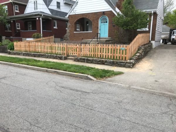 Gothic wood picket fence with gate